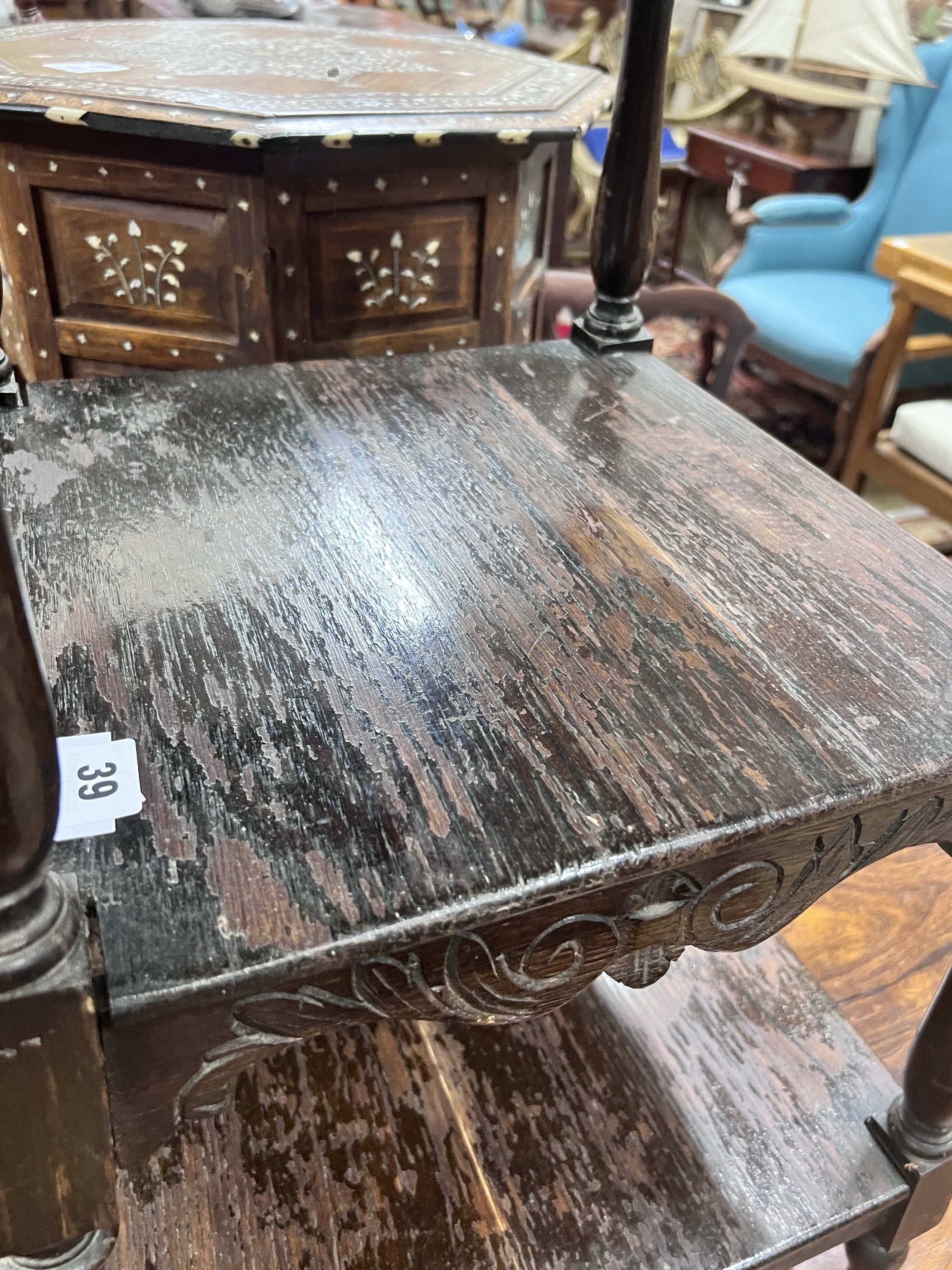 An early 20th century oak three tier occasional table, width 41cm, height 75cm